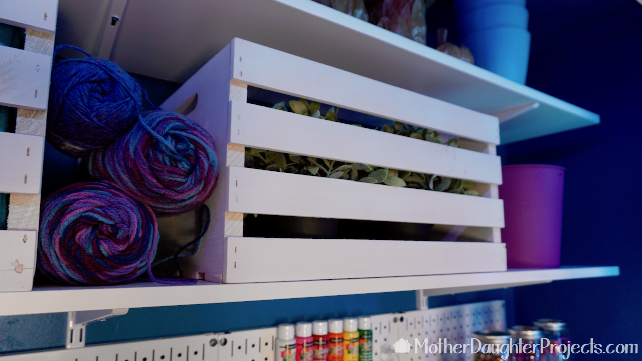 Video tutorial! Learn how to install pegboard, cabinets, and shelves to turn a small space into a creative workspace for sewing, making, gift wrap and more!