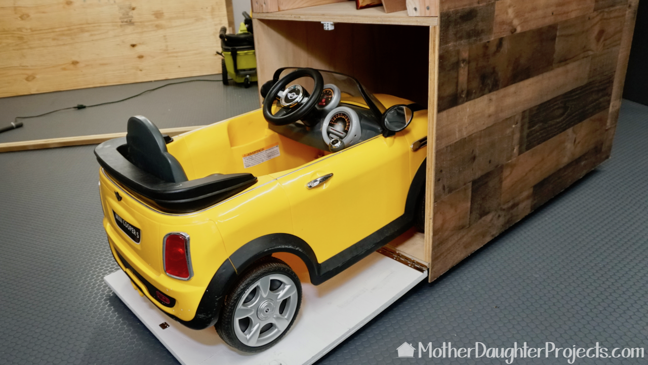 The mini Cooper fits perfectly into the garage. 