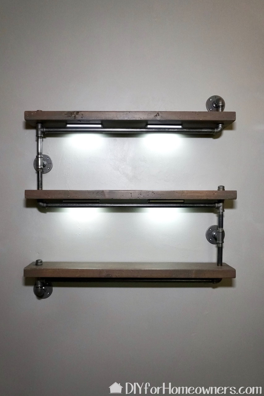 Finished metal pipe and wood diy industrial hanging bookshelf. 
