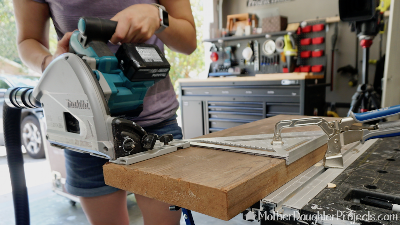 Cutting the board with the Makita track saw. 