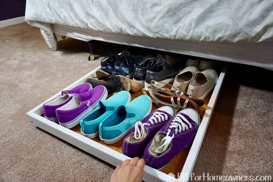 The under-the-bed roll out shoe storage here is holding almost a dozen pairs of shoes! It rolls easily in and out. 