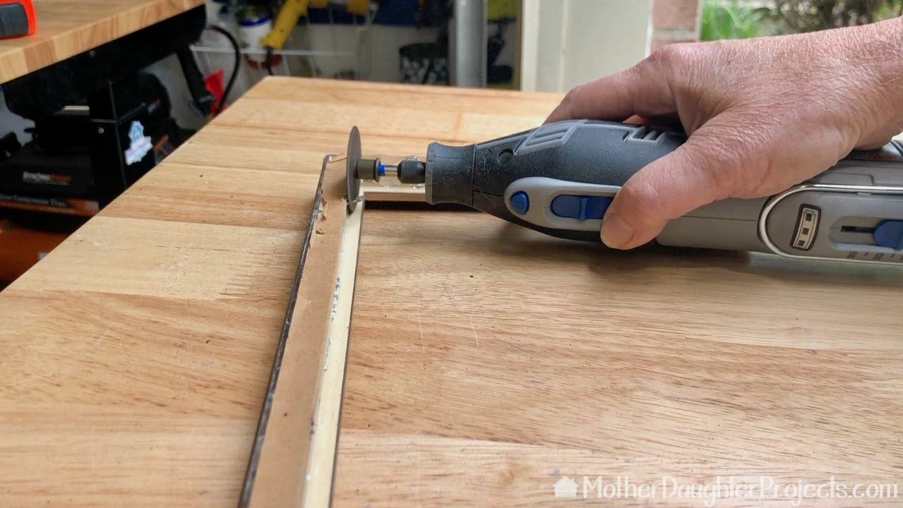 How to use a Dremel cutting accessory. 