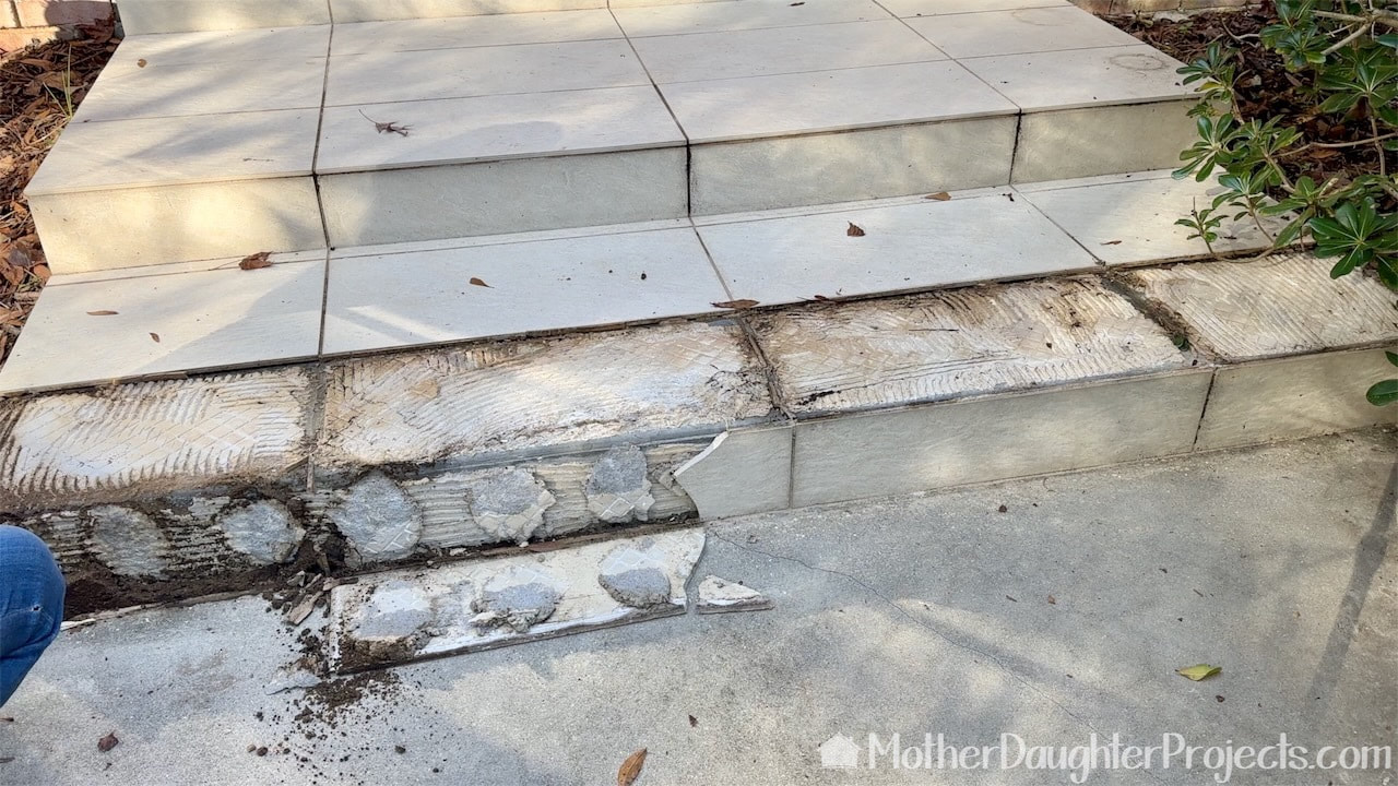 This is what the front door step looked like after thee loose tiles were removed. 