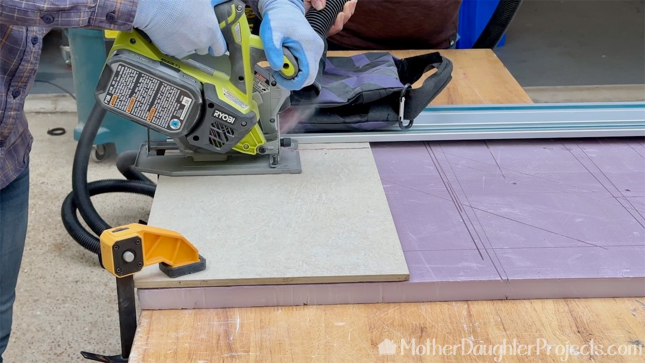 We placed the tiles top of a piece of insulation foam to protect our work surface. We are using a Ryobi 5 1/2 inch circular saw.