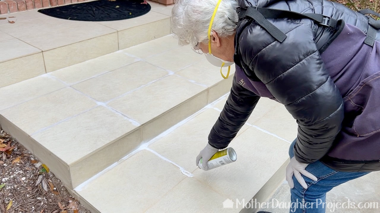 Applying the grout sealer.