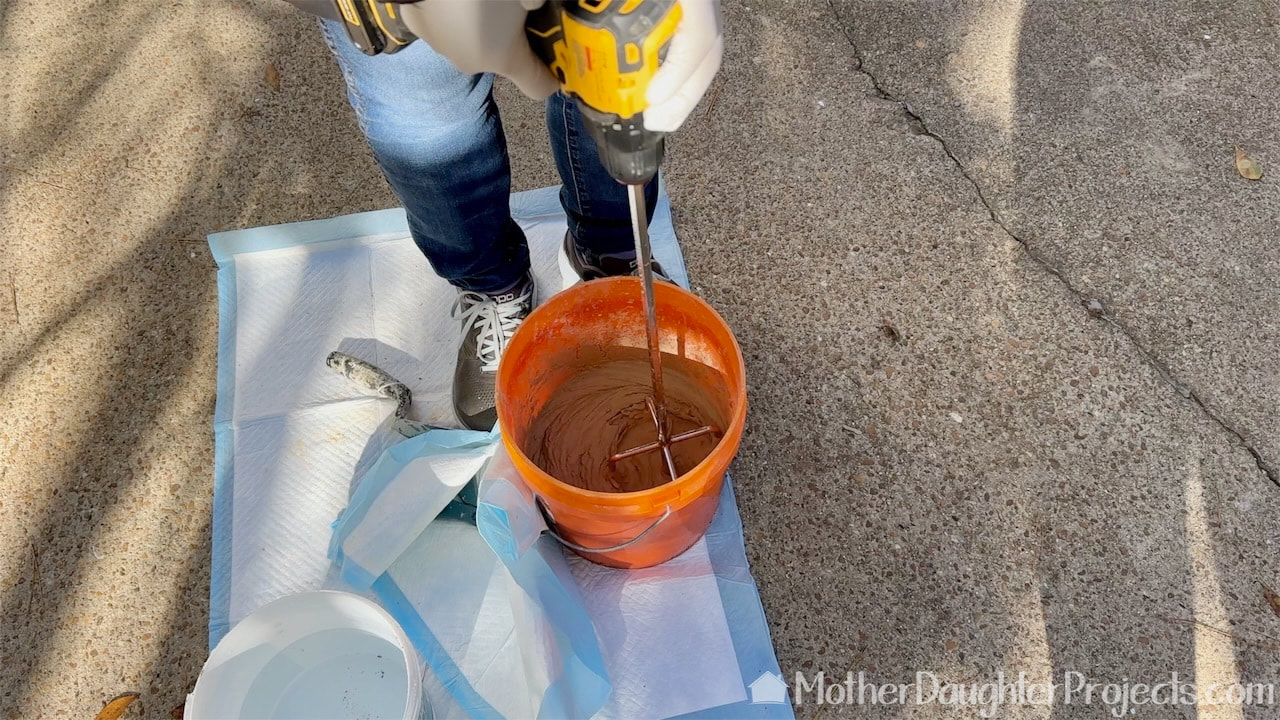 We attached a paddle mixer to our drill for easy mixing of the grout.