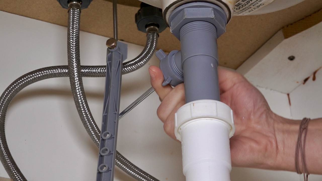 removing bathroom sink drain plug cable