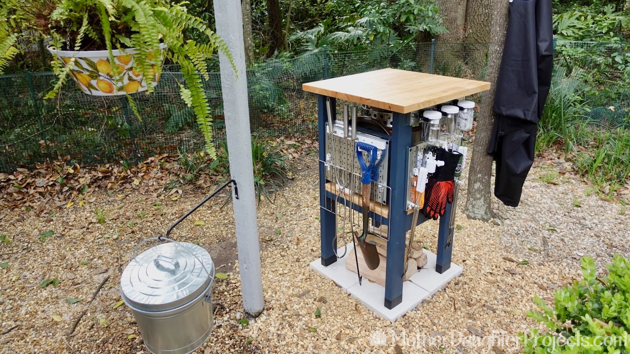 The DIY fire pit station also functions as a prep space or a high top table.