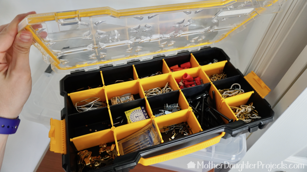 The Dewalt small compartment organizer is a great place to store picture hanging hardware. 