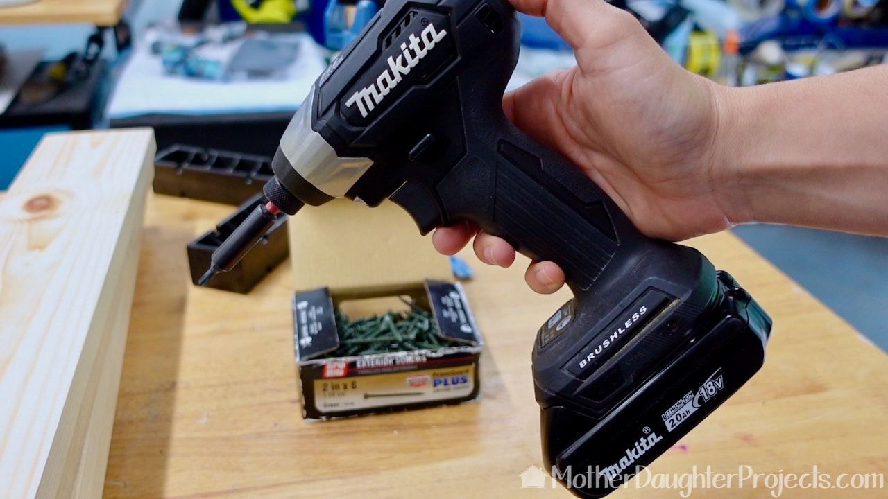 We are using a Makita compact impact driver to avoid having to make pilot holes. 