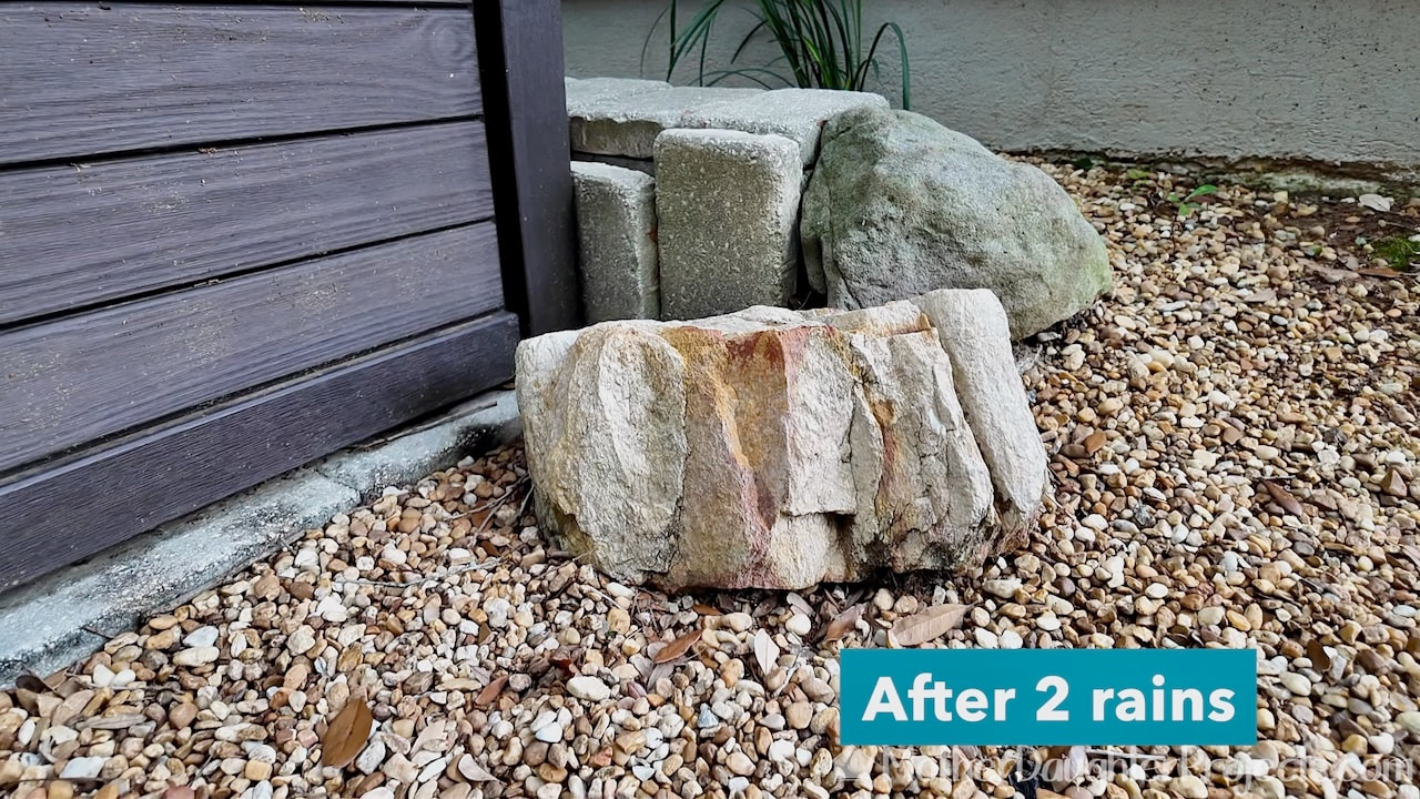 Showing a decorative garden rock that was cleaned with wet and forget outdoor cleaner ready to use spray.